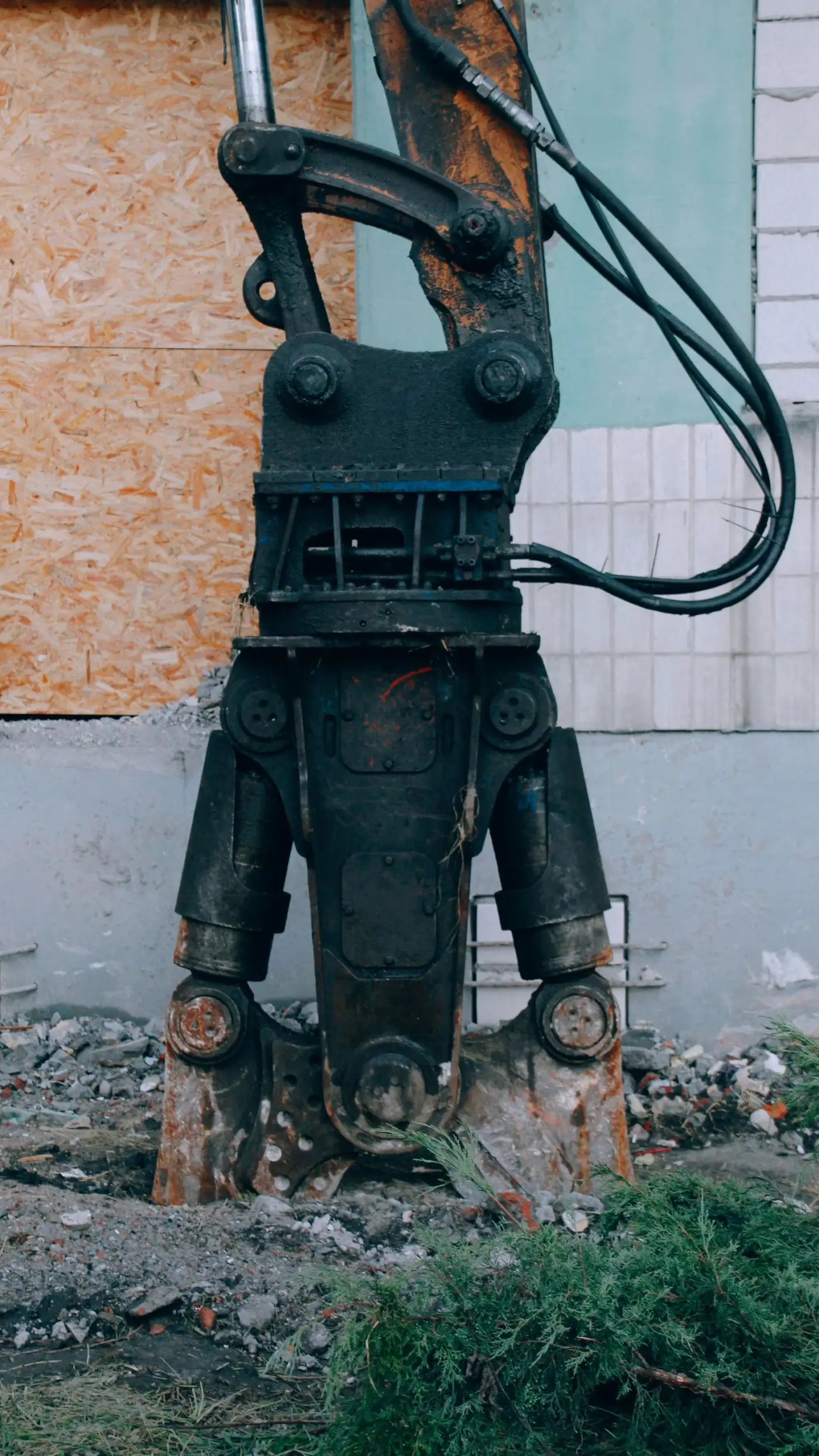 Excavator breaking up concrete on a demolition site