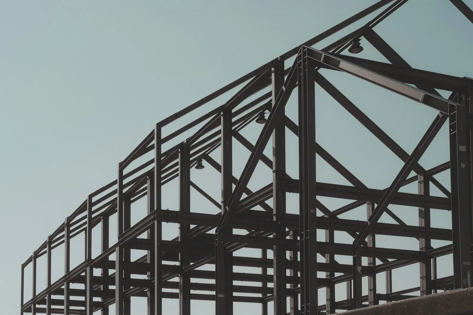 Structural steel shed frame against the sky